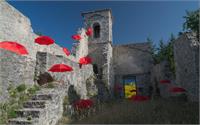 Red Umbrellas Into Old Church